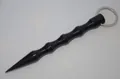 Close-up of black aluminum kubotan keychain with anti-slip grooves and a pointed tip - Pointed Head Black