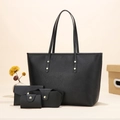 Macro detail of 4-piece set including black pebble leather tote bag and wallets - Black