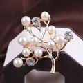 Golden tree brooch featuring white pearls and sparkling rhinestones on fabric background - xz4073A Gold Tree
