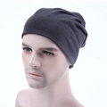 Dark grey knitted beanie for men and women shown on a model head in a side view - Dark Heather Grey
