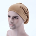 Detail of khaki slouchy beanie made of soft knitted cotton on a white background - Khaki