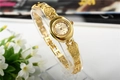 Elegant gold quartz bracelet watch with heart-shaped strap links and round dial - Gold Heart Decor Strap Style (WAT04101J)