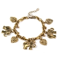 Vintage gold metal elephant and hollow heart charm bracelet on a clean white background - Bronze