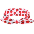 White elastic baby headband with red strawberry print and a central knotted rabbit ear bow - Strawberry