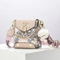 Pink paisley patterned crossbody bag with gold swan buckle and wide strap on white stand - Khaki