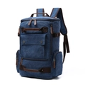Blue canvas travel backpack with brown leather accents and multi-pocket functional design - Blue