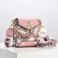 Pink PU leather crossbody bag with paisley patterns, gold swan clasp and plush charm - Pink
