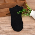 Classic black cotton low-cut ankle socks for men displayed on a natural wooden background - One Size / Black