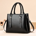Elegant black PU leather handbag with silver metal detail and adjustable shoulder strap - Retro Black