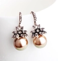 Detailed macro view of vintage sunflower earrings with champagne pearls and sparkling crystals - Champagne Pearl / Gold