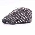 Detail of striped knitted newsboy cap with adjustable rear metal buckle and leather strap - Adjustable / Black Stripe
