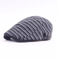 Close-up of striped knit newsboy cap showing blue-grey twill texture and metal side buckle - Adjustable / Navy Striped