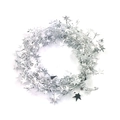 Macro shot of silver Christmas star garland with shiny metallic pentagram fringe details - Silver