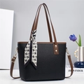 Elegant black lychee leather tote bag with brown handles and houndstooth scarf detail - Black