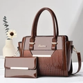 Detail of dark brown patent leather handbag and matching wallet with crocodile pattern - Brown