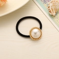 Elastic hair tie featuring a large pearl pendant with golden textured metal base - Semicircle Pearl