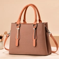 Minimalist orange canvas crossbody bag with brown leather handles and shoulder strap - Fabric Earth Yellow