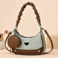 Striped green and white woven hobo bag with brown leather trim and a small round coin purse - Green