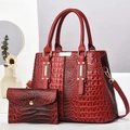 Detail shot of red crocodile embossed handbag and matching wallet with glossy finish - Burgundy Crocodile Pattern (A92115)