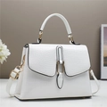White crocodile embossed leather handbag with gold metal hardware and adjustable strap - White