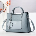 Light blue pleated leather handbag with top handles and adjustable shoulder strap - Blue