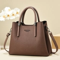 Detailed view of brown pleated tote bag with round handles and FASHION Queen logo - Coffee