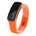 Detail view of vibrant orange LED sports watch with silicone band on white background - Orange
