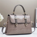 Elegant taupe crocodile embossed leather crossbody handbag with gold hardware - Gray