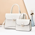 Elegant white leather handbag set with U-shaped gold buckle and stylish pleated design - White