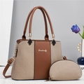 Detail of khaki canvas tote and matching semicircular pouch with brown leather accents - Khaki