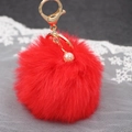 Portachiavi con pompon rosso morbido, chiusura dorata e ciondolo di perla elegante - Rosso