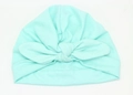 Dettaglio del turbante per neonati in maglia verde menta con un grande fiocco decorativo - Verde Menta