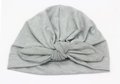 Detail of light gray baby turban hat showing soft knit texture and large bow knot - Gray