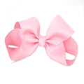 Detail shot of a large pink grosgrain ribbon bow hairpin for baby girls hair accessory - Pink