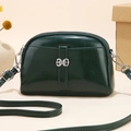 Elegant dark green shell-shaped shoulder bag with glossy patent finish and metal buckle - Dark Green