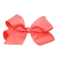 Detail of a 15cm coral pink grosgrain ribbon hair bow for babies on white background - Watermelon red