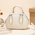 Creamy white shell-shaped handbag with polished gold hardware and detachable strap - Off White