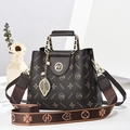 Deep brown monogram crossbody bag with gold AA logo and floral eucalyptus background - Coffee Style 1