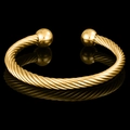 Elegant gold-plated twisted open bangle bracelet with ball ends on a black reflective background - Two Colors