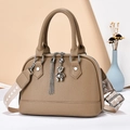 Minimalist khaki brown crossbody bag with wide patterned strap and silver bear charm - Khaki