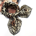 Elegant leopard print silk scarf tied in a bow on a white background for women - 5002 Leopard Print