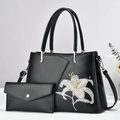 Black faux leather tote bag with white lily embroidery and matching envelope wallet - Black
