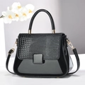 Elegant black crocodile-pattern handbag with top handle and gold hardware in minimalist style - Black