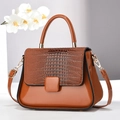 Elegant brown patent leather handbag with crocodile pattern flap and gold hardware - Earthy Yellow