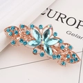Floral hair clip featuring golden metal and blue crystals for thick hair styling - Lake Blue Petal