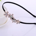 Elegant black headband with four sparkling rhinestone metal flower accents for girls - Four Rhinestone Flowers