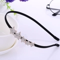 Black slim headband featuring five sparkling rhinestone stars with golden base - Five-pointed Star Rhinestone