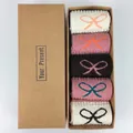 Five pairs of wool Christmas socks with bow patterns in a kraft gift box packaging - Bowknot Style