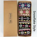Five pairs of winter wool socks with snowflake patterns in a brown gift box - Vintage