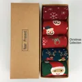 Detailed view of 5-pack Christmas wool socks with reindeer patterns in a gift box - Christmas Collection
